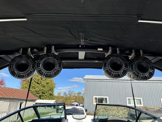 Slide: The Image of 2022 Chaparral 287 SSX boat speakers under canopy, outdoor setting. - 18