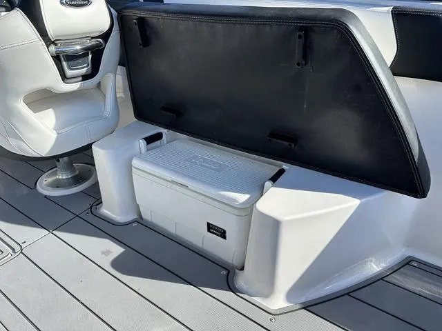 Slide: The Image of 2022 Chaparral 287 SSX boat interior with cooler storage compartment. - 21