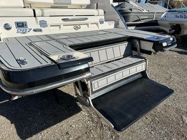 Slide: The Image of 2022 Chaparral 287 SSX boat with extended swim platform and integrated steps. - 3
