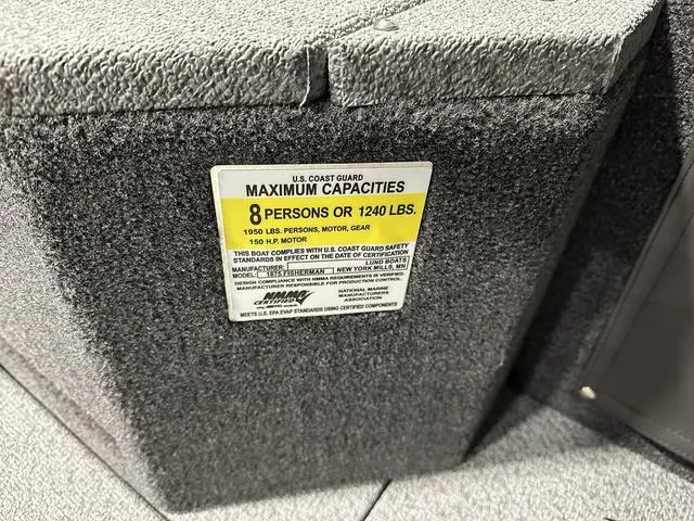 Slide: The Image of Sticker on 2025 Lund 1875 Fisherman Sport showing maximum capacity of 8 persons or 1240 lbs. - 18