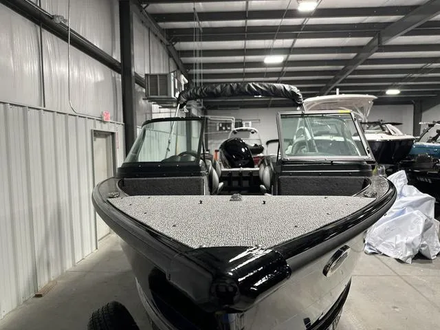 Slide: The Image of 2025 Lund 1875 Fisherman Sport boat in a showroom, front view. - 3