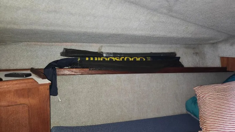 Slide: The Image of Interior cabin of 1987 Hunter 26.5 sailboat with shelf and bedding. - 16