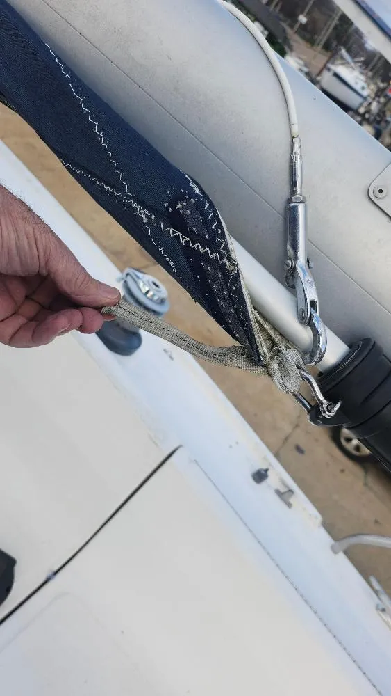 Slide: The Image of Close-up of a 1987 Hunter 26.5 sailboat rigging and sail detail. - 24