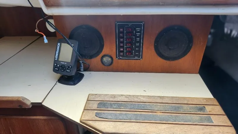 Slide: The Image of Interior of 1987 Hunter 26.5 sailboat with control panel and navigation device. - 9
