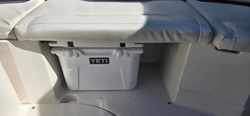 Slide: The Image of YETI cooler under seat in 2010 Monterey 254FS boat. - 14
