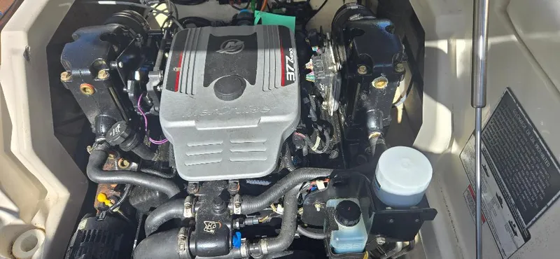 Slide: The Image of Engine compartment of a 2010 Monterey 254FS boat, showcasing detailed components and layout. - 5