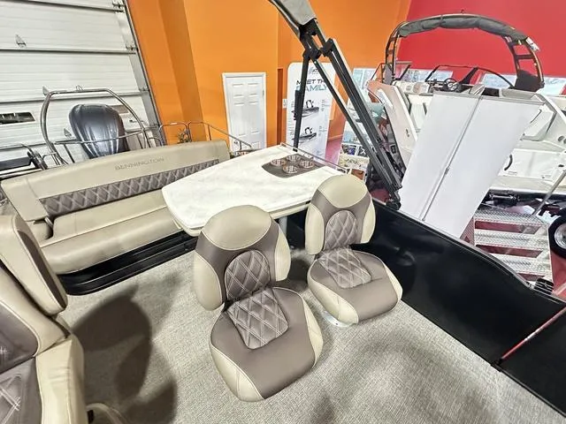 Slide: The Image of 2025 Bennington 24 LXSB boat interior with luxurious seating and modern design. - 12