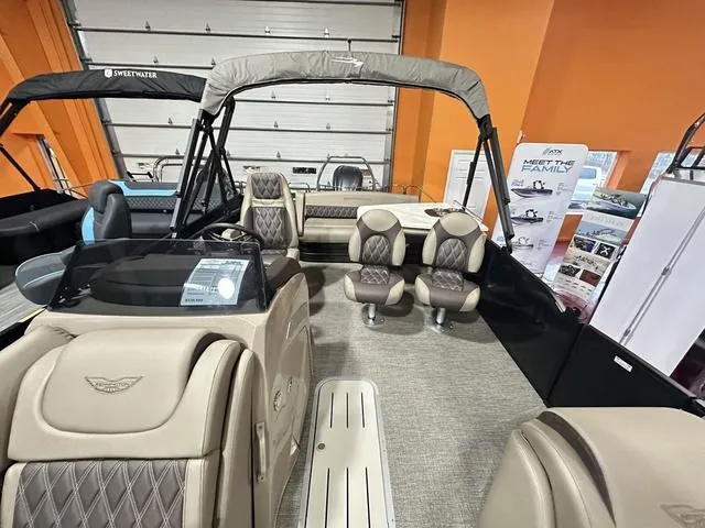 Slide: The Image of 2025 Bennington 24 LXSB pontoon boat interior with beige seating and modern design. - 13