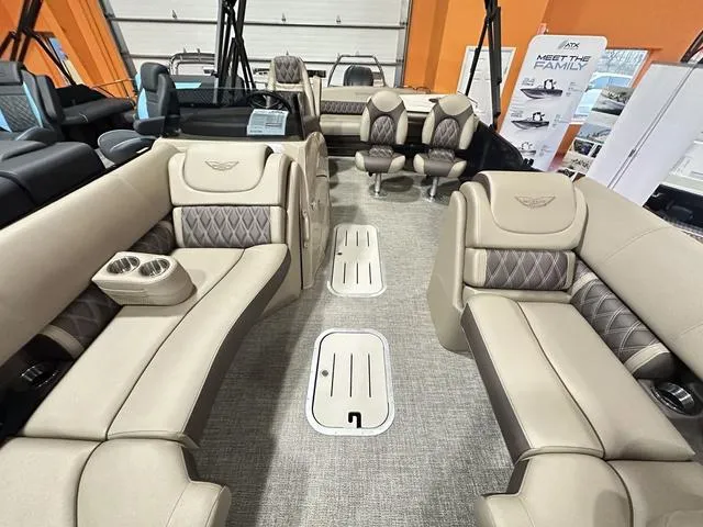 Slide: The Image of 2025 Bennington 24 LXSB boat interior with luxurious beige seating and modern design. - 14
