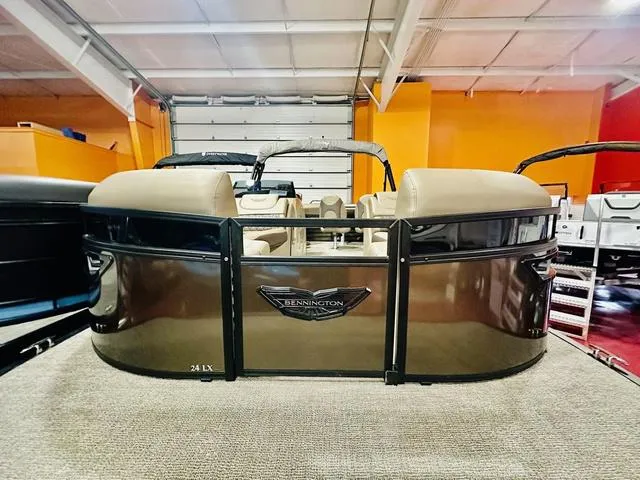 Slide: The Image of 2025 Bennington 24 LXSB pontoon boat in showroom, front view. - 3