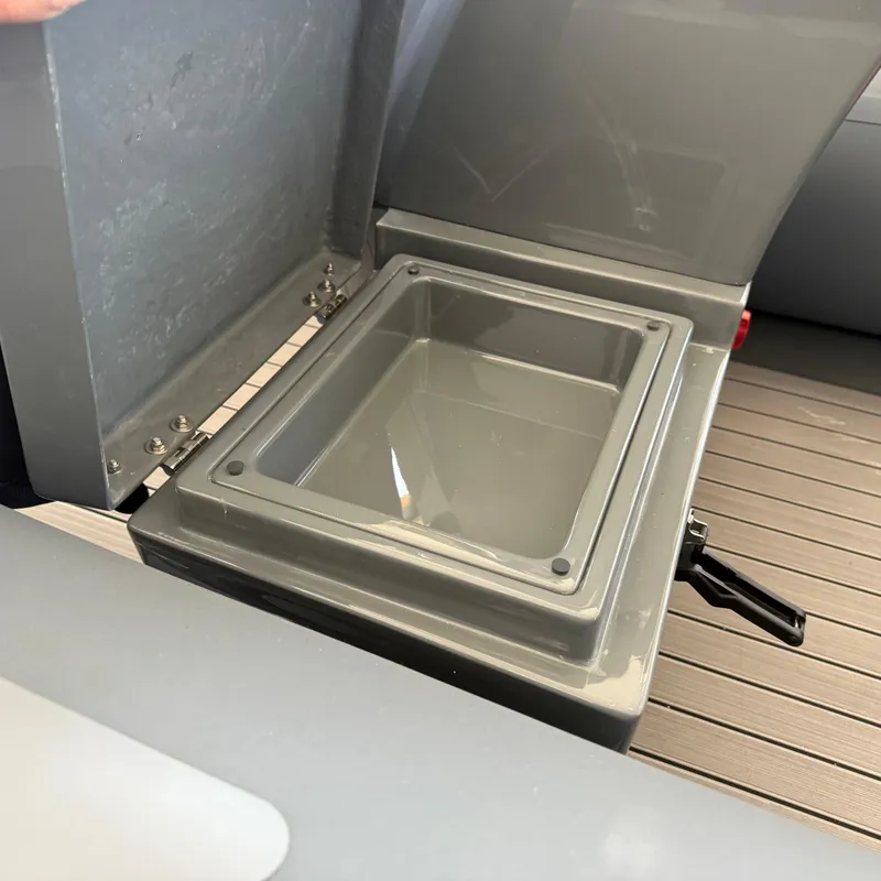 Slide: The Image of Open storage compartment on 2025 Highfield Sport 360 boat, showcasing interior design. - 16