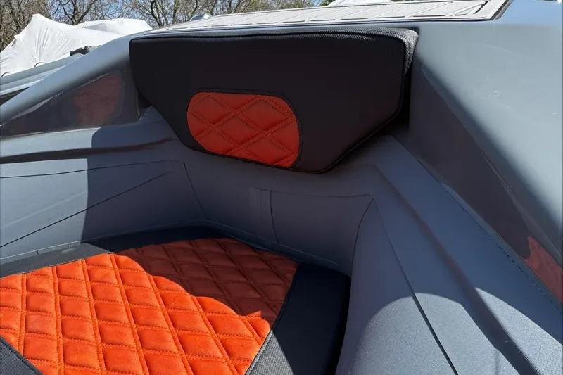 Slide: The Image of 2025 Highfield Sport 460 boat interior with orange quilted seats and sleek design. - 3