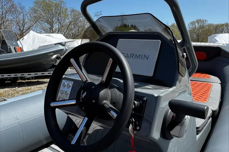 Slide: The Image of 2025 Highfield Sport 460 boat dashboard with Garmin navigation system. - 6