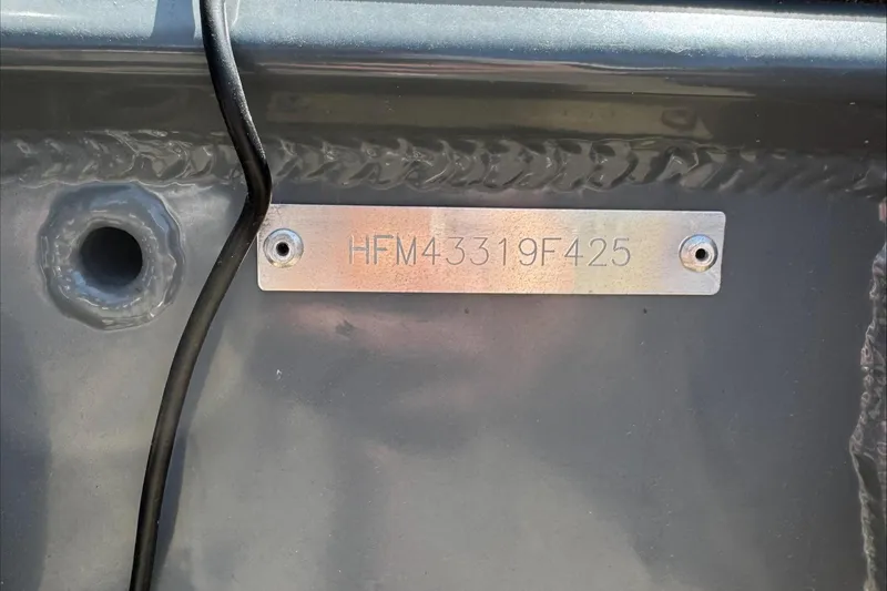 Slide: The Image of Hull identification number on a 2025 Highfield Sport 460 boat. - 7