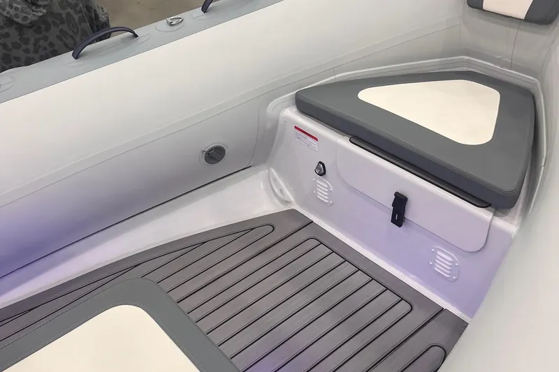 Slide: The Image of 2024 Highfield Classic 420 boat interior with seating and storage compartments. - 5