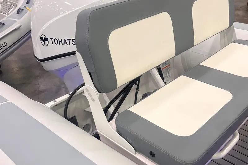 Slide: The Image of 2024 Highfield Classic 420 boat with Tohatsu engine, featuring comfortable seating. - 6