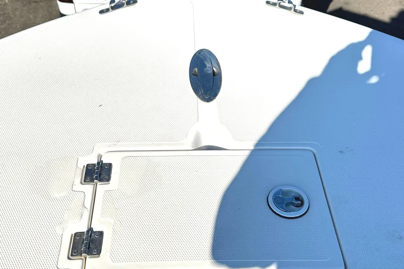 Slide: The Image of KenCraft 230 SEA KING 2006 boat deck with storage hatch and metal fittings. - 11