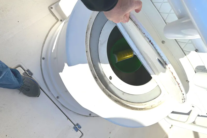 Slide: The Image of KenCraft 230 SEA KING 2006 boat hatch being opened on deck. - 15