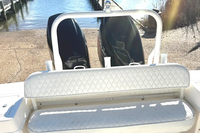 Slide: The Image of 2006 KenCraft 230 SEA KING boat with dual engines and cushioned seating. - 16