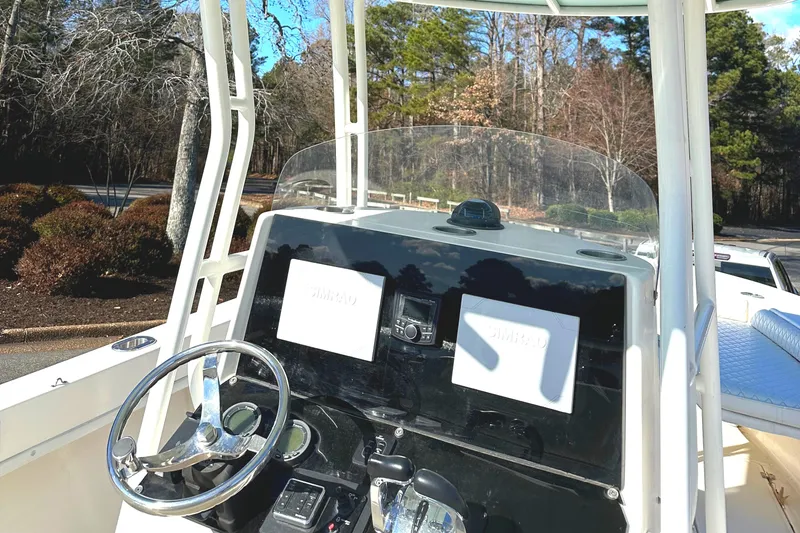 Slide: The Image of 2006 KenCraft 230 SEA KING boat dashboard with steering wheel and controls. - 17