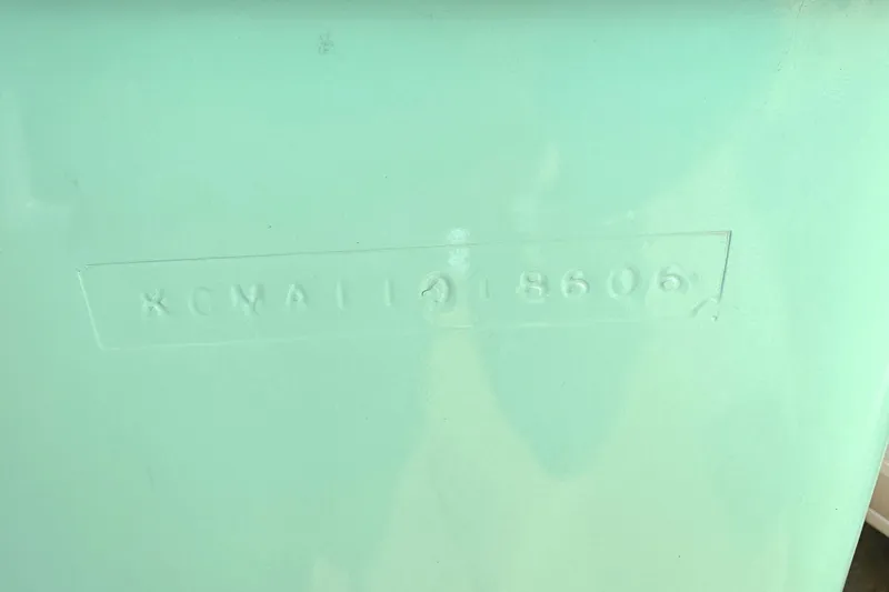 Slide: The Image of KenCraft 230 SEA KING 2006 hull identification number embossed on light green surface. - 3