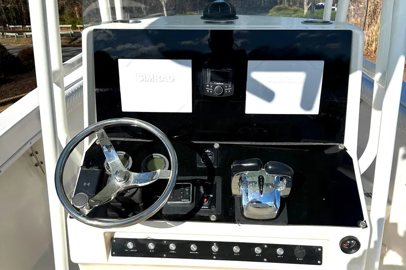 Slide: The Image of 2006 KenCraft 230 SEA KING boat dashboard with steering wheel and controls. - 6