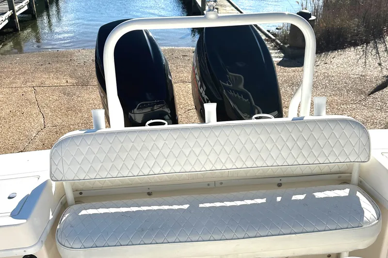 Slide: The Image of KenCraft 230 SEA KING 2006 boat with dual engines and cushioned seating. - 9