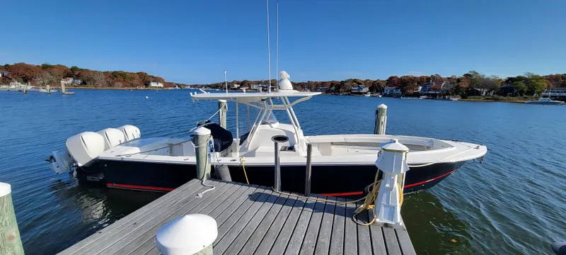 Slide: The Image of 2018 Regulator 34SS boat docked on a sunny day. - 10