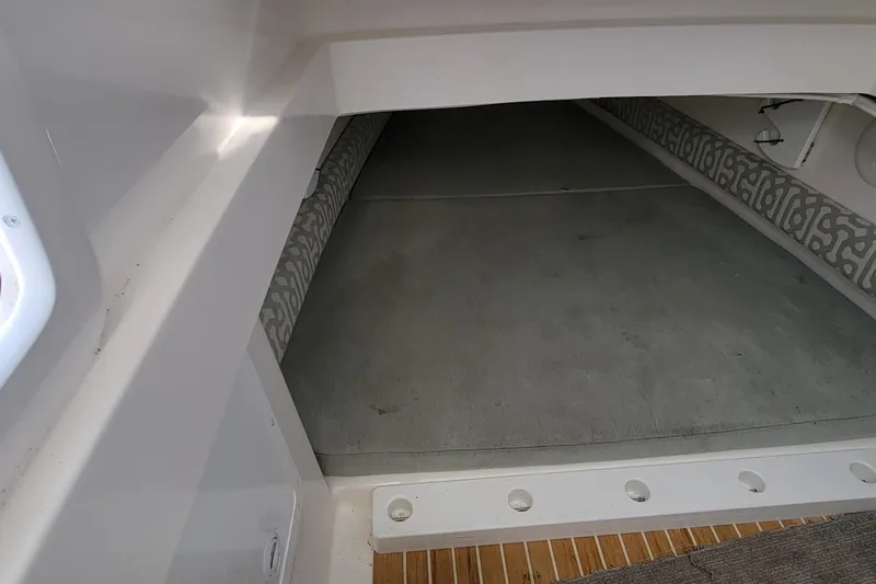Slide: The Image of 2018 Regulator 34SS boat interior storage compartment. - 13