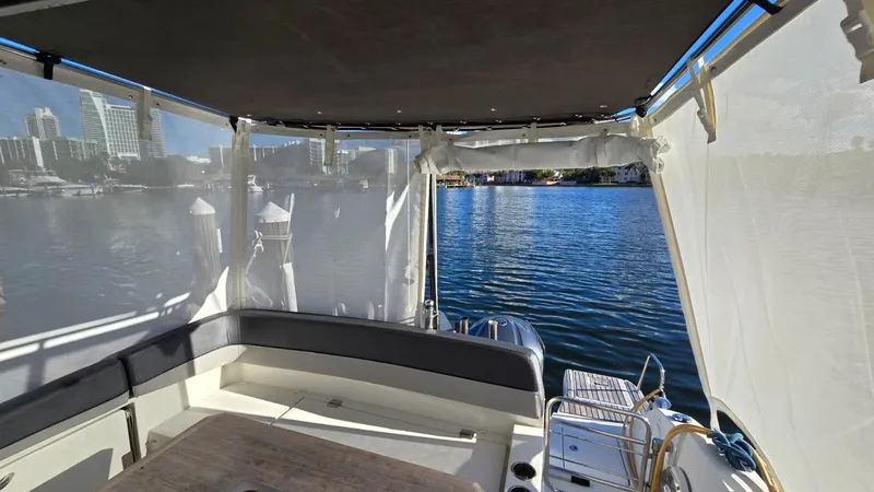 Slide: The Image of Interior view of 2019 Jeanneau Leader 10.5 boat with waterfront cityscape. - 21