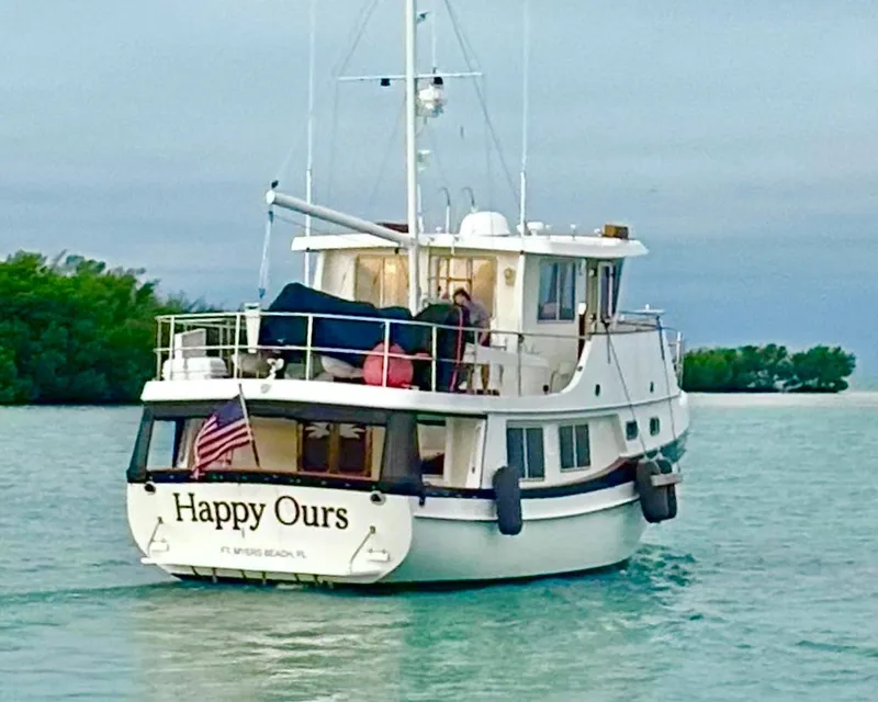 Slide: The Image of Kadey-Krogen 48 Whaleback yacht "Happy Ours" cruising in serene waters, 2001 model. - 0