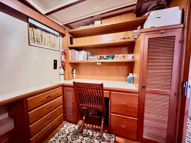 Slide: The Image of Cozy wooden study area in a 2001 Kadey-Krogen 48 Whaleback yacht. - 19