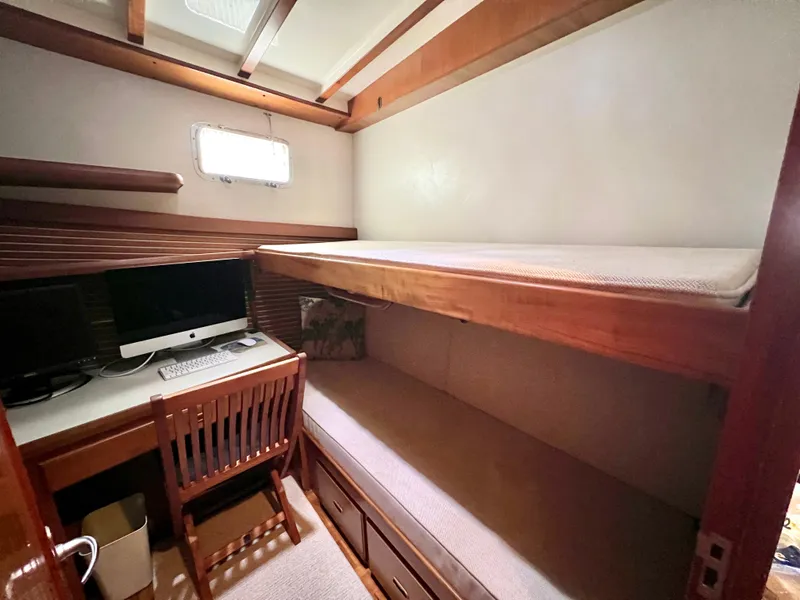 Slide: The Image of Cozy cabin interior of 2001 Kadey-Krogen 48 Whaleback with bunk beds and desk. - 24