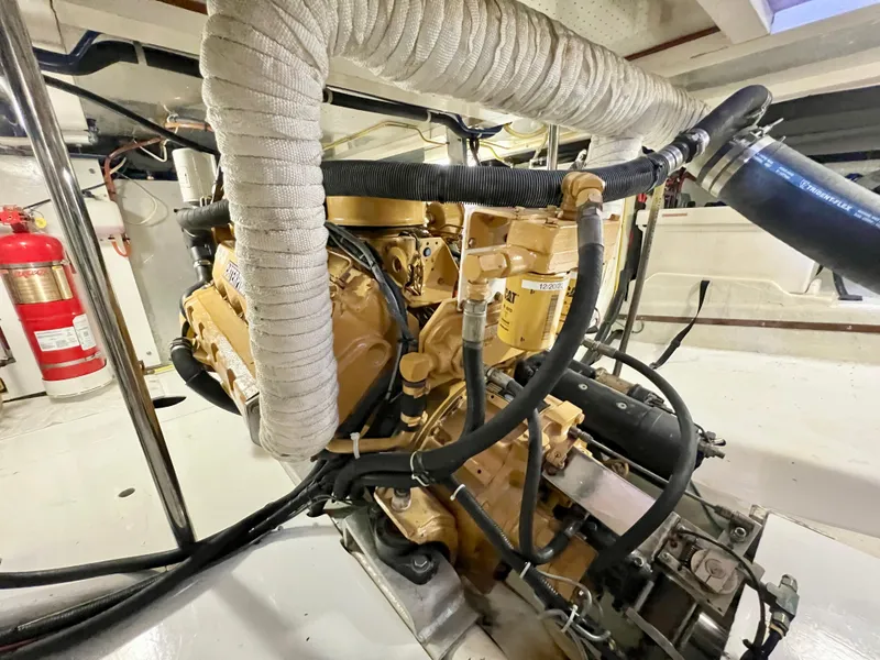 Slide: The Image of Engine room of 2001 Kadey-Krogen 48 Whaleback yacht, featuring detailed machinery and components. - 30