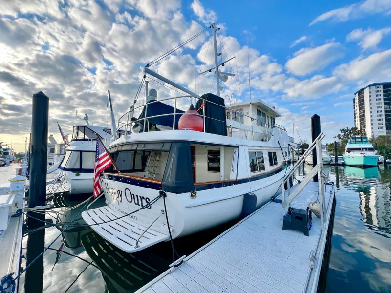 Slide: The Image of Kadey-Krogen 48 Whaleback 2001 yacht docked at marina under blue sky. - 4