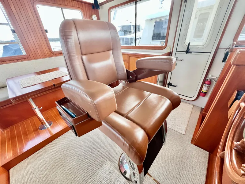 Slide: The Image of Luxurious leather captain's chair in 2001 Kadey-Krogen 48 Whaleback yacht interior. - 41