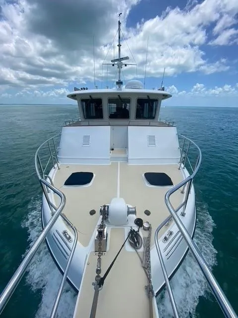 Slide: The Image of Kadey-Krogen 48 Whaleback 2001 yacht cruising on open sea under cloudy sky. - 5