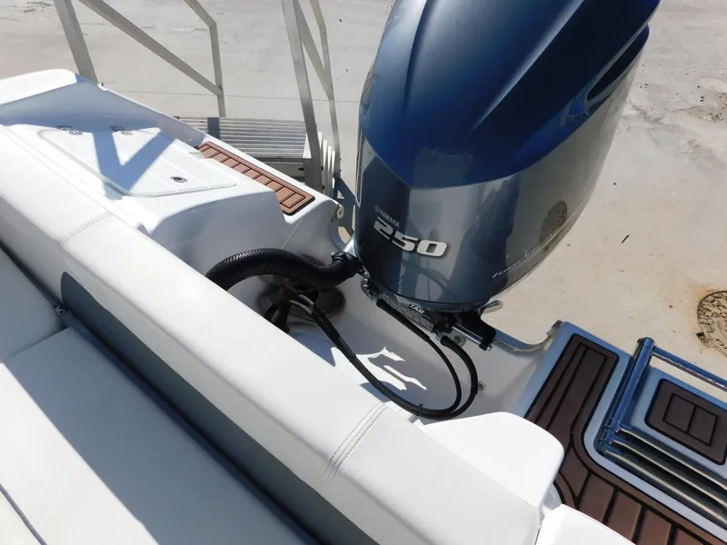 Slide: The Image of 2017 Tidewater 220 LXF boat with powerful 250 engine, sleek design, and comfortable seating. - 10