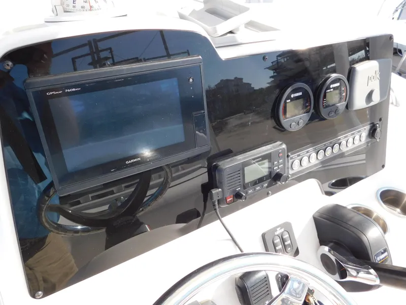 Slide: The Image of Dashboard of 2017 Tidewater 220 LXF boat with navigation and control instruments. - 20