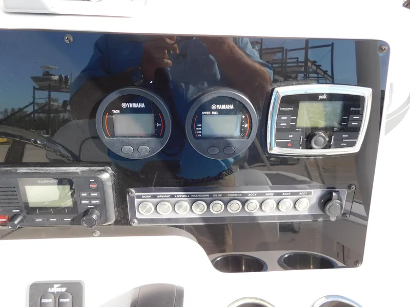 Slide: The Image of Dashboard of 2017 Tidewater 220 LXF boat with Yamaha gauges and Polk audio system. - 21