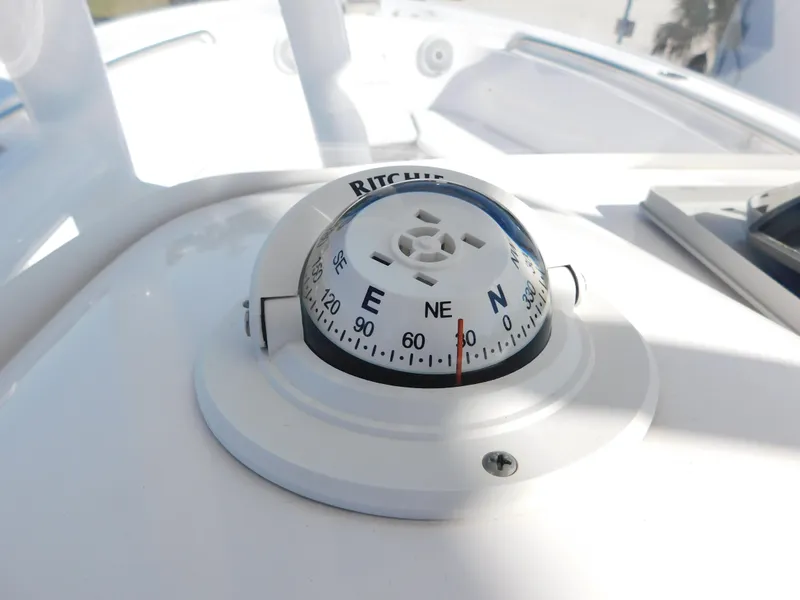 Slide: The Image of Compass on 2017 Tidewater 220 LXF boat dashboard, showing northeast direction. - 22