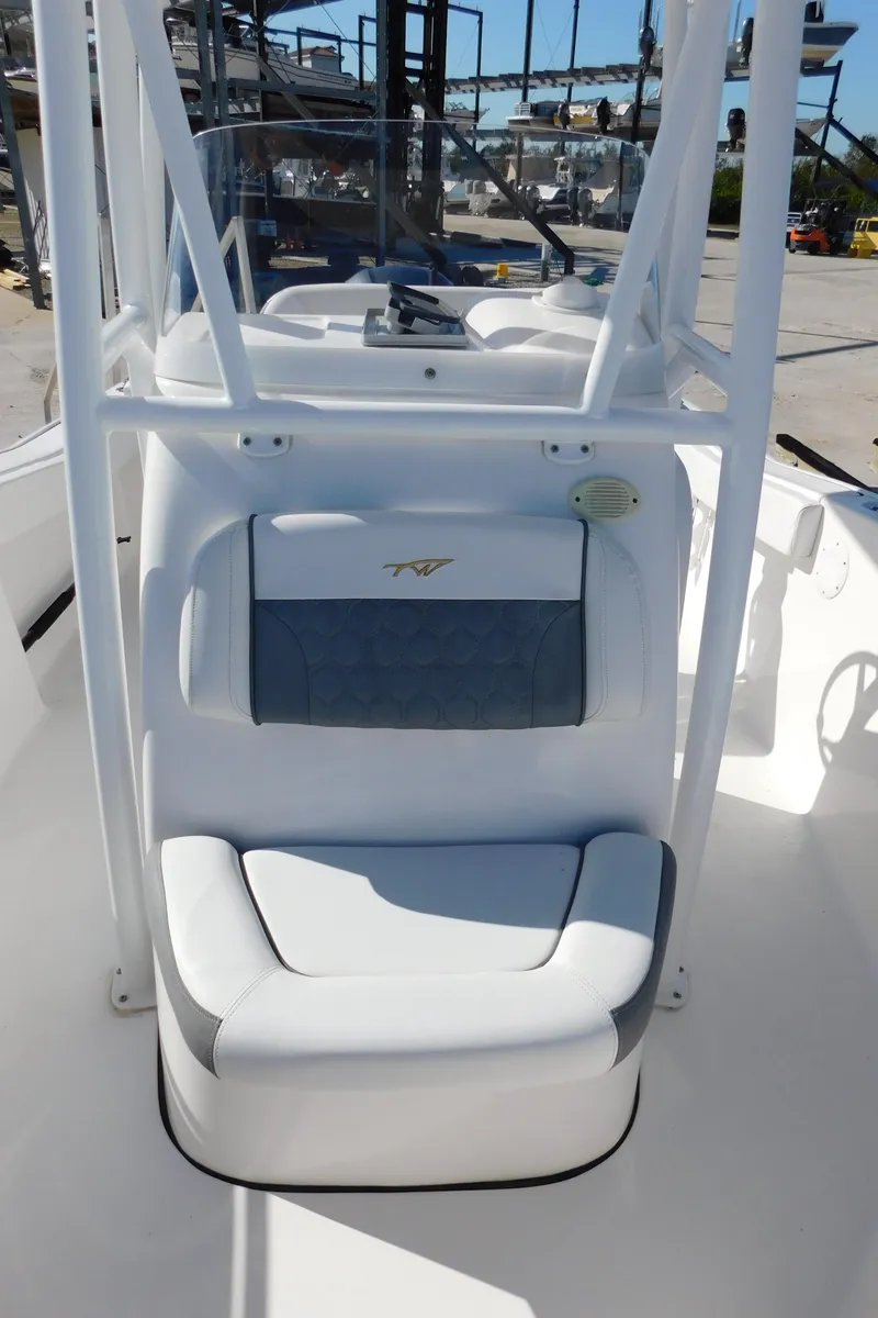 Slide: The Image of 2017 Tidewater 220 LXF boat interior with cushioned seating and console. - 35