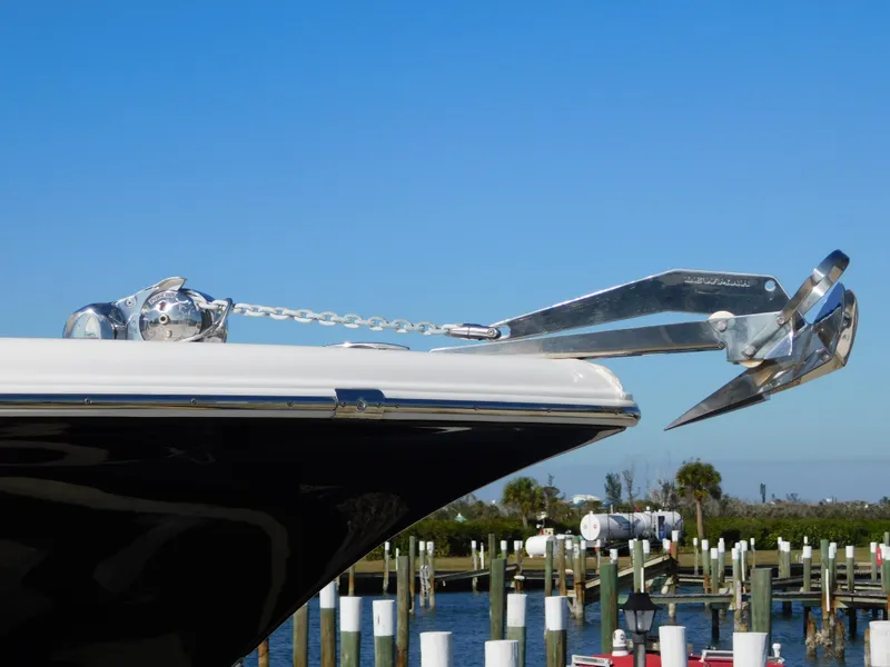 Slide: The Image of 2017 Tidewater 220 LXF boat with anchor, docked in a marina. - 8