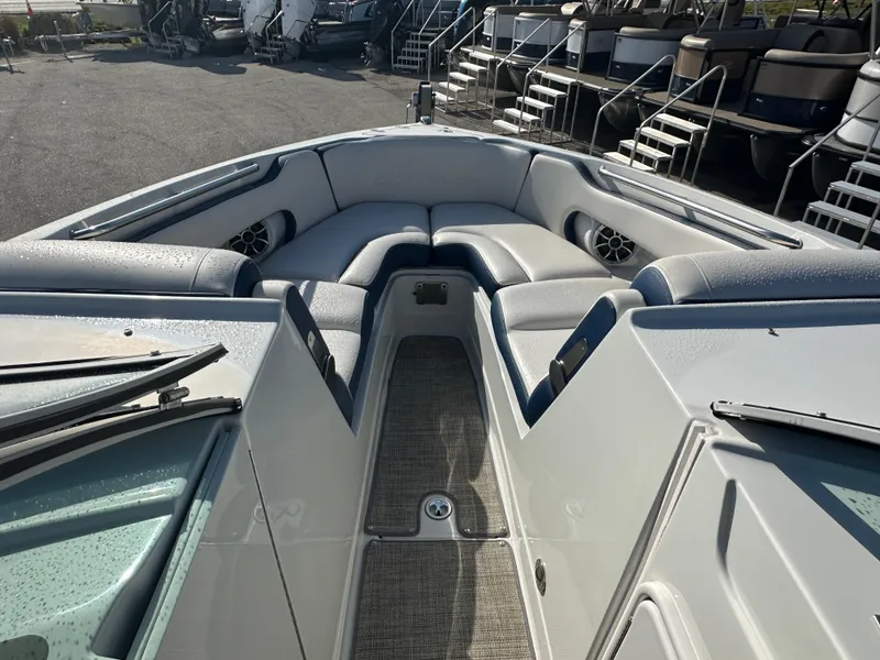 Slide: The Image of 2022 Crownline 260 XSS boat interior with spacious seating and modern design. - 12