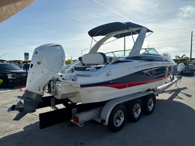 Slide: The Image of 2022 Crownline 260 XSS boat on trailer, featuring sleek design and powerful outboard motor. - 5
