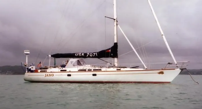 Slide: The Image of Sailing yacht Farr 55, 1994 model, named Jano, anchored on calm waters. - 0