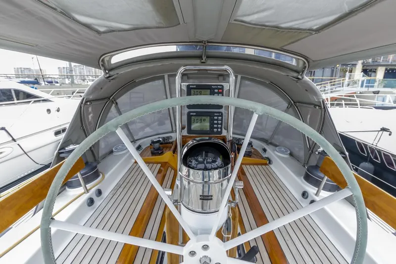 Slide: The Image of Cockpit of 1994 Farr 55 yacht with steering wheel and navigation instruments. - 16
