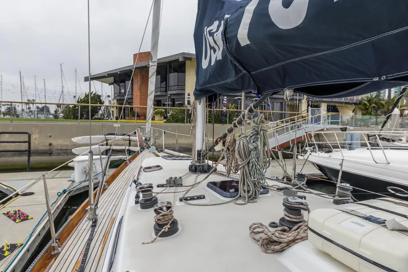 Slide: The Image of Sailboat Farr 55, 1994 model, docked at marina with rigging and sails visible. - 19