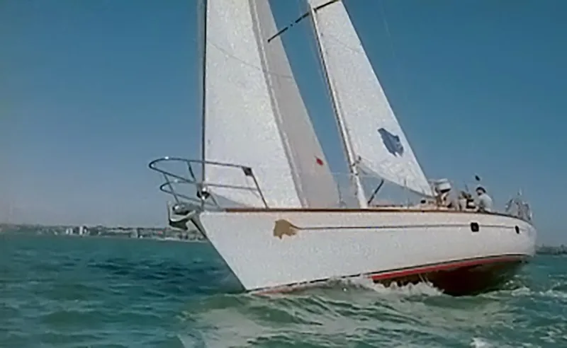Slide: The Image of Sailing yacht Farr 55, 1994 model, cruising on open water. - 2