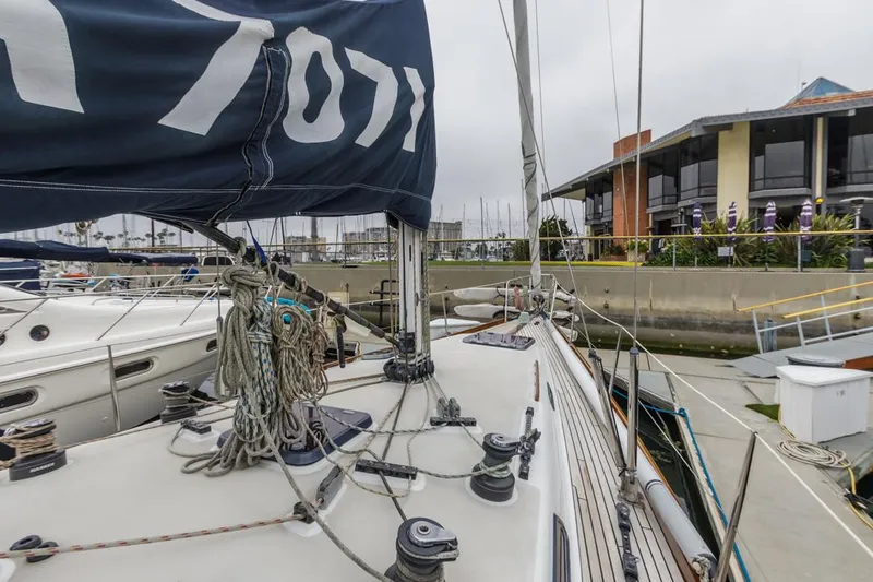 Slide: The Image of Sailboat Farr 55, 1994 model, docked at marina with visible rigging and sails. - 20